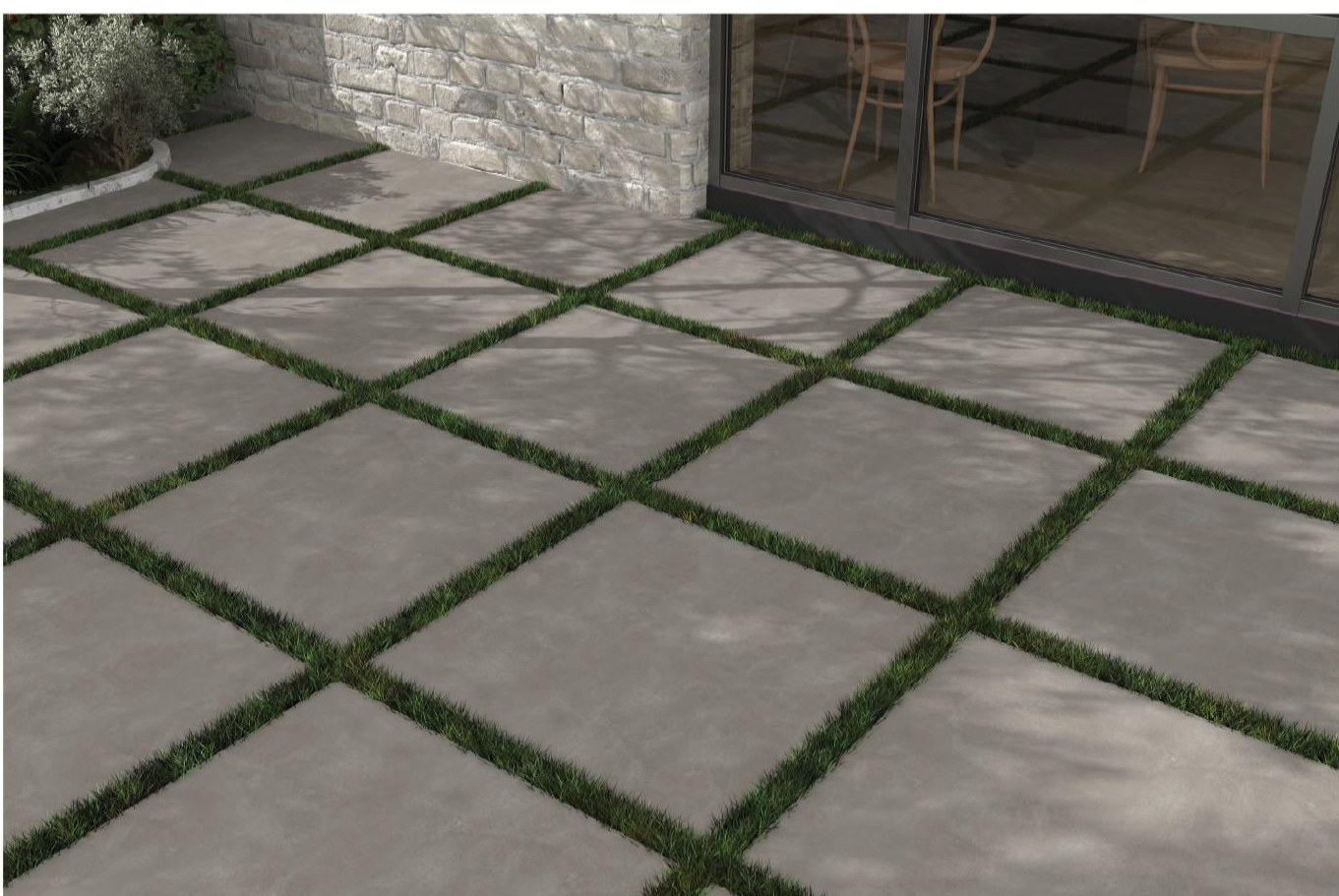 Elba 60x60 cm pavers set in grass joints outside a garden room