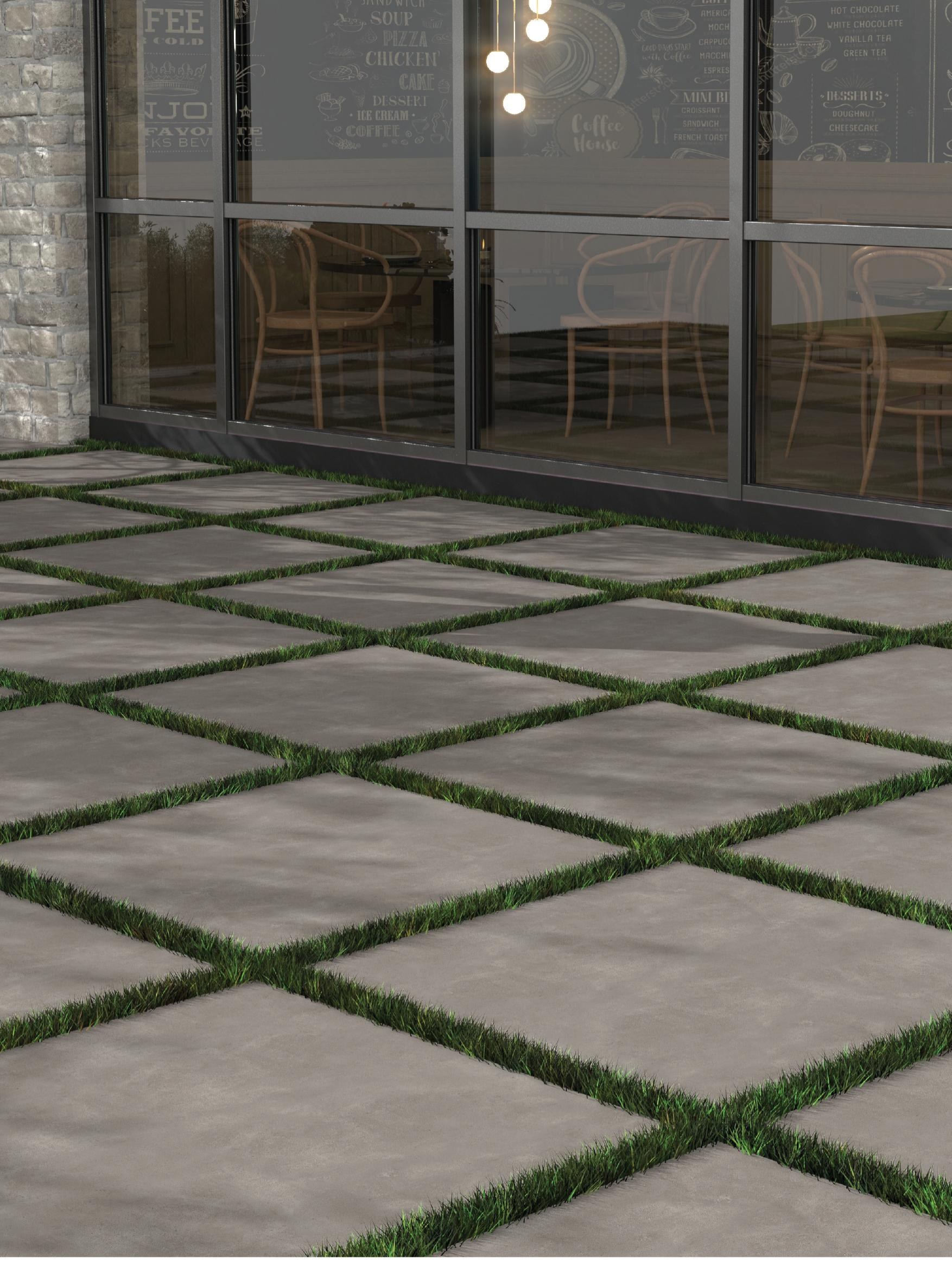 Elba 60x60 cm 20 mm paving with grass joints at a cafe terrace